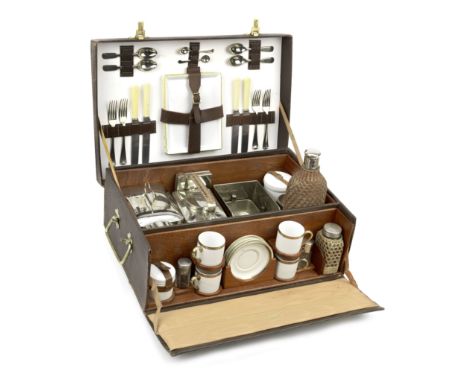 A fine leather-cased picnic set for four persons, by Finnigans of Deansgate, Manchester, circa 1909,brown textured leather ca