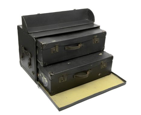 A motoring trunk with interior cases, 1920s,black Rexine trunk with leather handles and loops on leather straps to each end, 