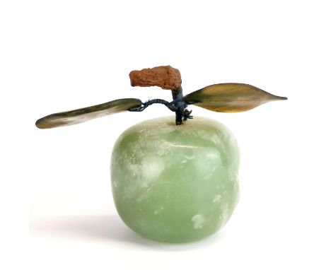 A Chinese carved jade / hardstone apple, H. 10cm.