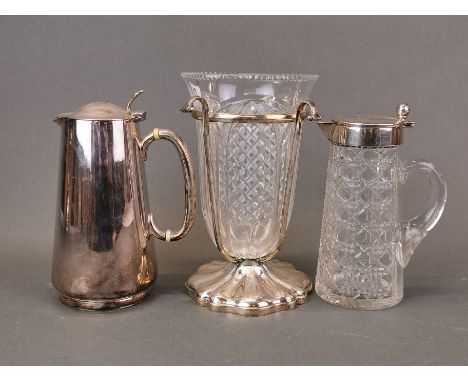 An Edwardian silver plate and cut glass jug, H. 19cm, together with a silver plate hot water jug and a silver plated and cut 