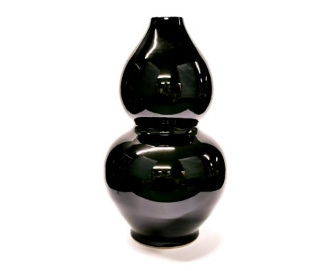 An unusual large Chinese black glazed porcelain table lamp base, H. 40cm.