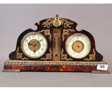 An Ormulu mounted tortoise shell covered 19th century clock barometer, W. 38cm, H. 21cm.