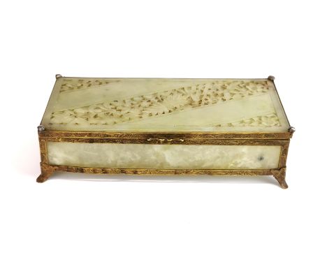 A fine Chinese gilt metal mounted carved jade box with hinged lid, 19 x 9.5 x 5cm.