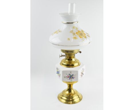Vintage brass oil lamp with ceramic decoration, 55cm tall.  
