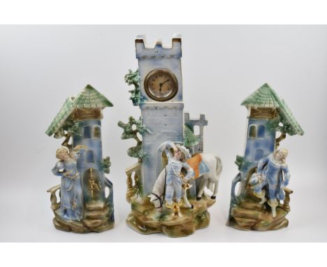 Edwardian continental pottery mantle clock with matching garniture vases (3), 41cm tall.  Generally in good condition, firing