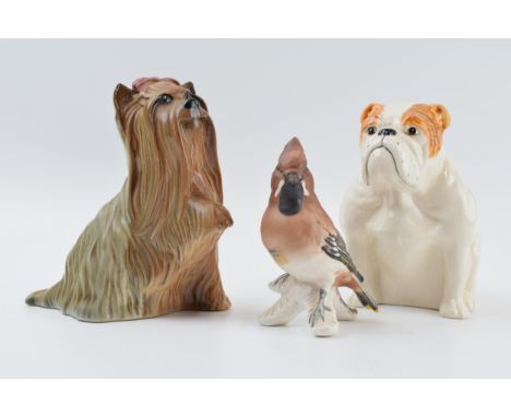 Beswick Bulldog together with a Yorkshire Terrier with raised paw (second) together with a Goebel waxwing bird (3).  In good 