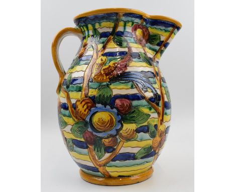 Late 19th / Early 20th Century decorative jug in an abstract style with ribbed decoration of birds and flowers in greens, blu