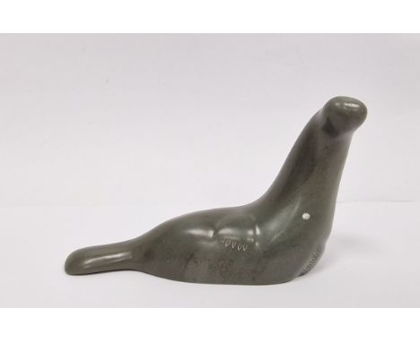 Carved Inuit (Canadian) soapstone model of a seal by Isaac Appaqaq, incised signature to base, with Eskimo Art label, 12cm lo