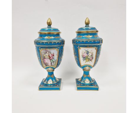 Pair of late 19th century Sevres-style turquoise ground vases and covers, each with pine cone finial, jewelled and painted wi