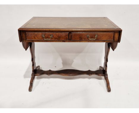 Reproduction walnut sofa table, the top with gilt tooled leather insert and two short drawers to the front, 73cm high x 97cm 