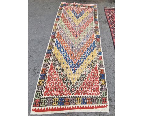 Central Anatolian rug/runner,&nbsp;woven with blue, yellow, manganese and green lozenge-shaped pattern ground within a geomet