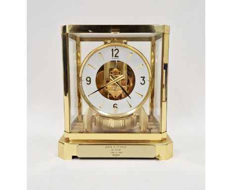 1970’s/80’s Jaeger Le Coultre Atmos mantel clock, the circular dial having alternating gilt Arabic and baton hour markers, in