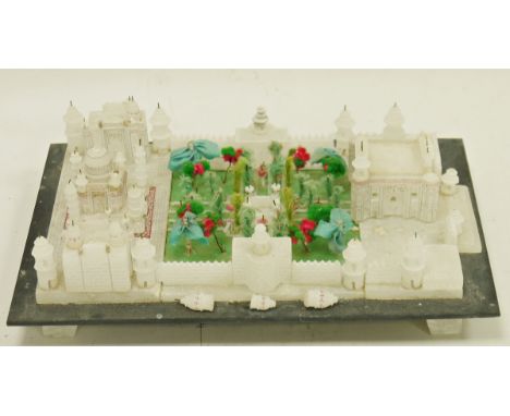 Vintage alabaster model of the Taj Mahal, the building centred by a fabric and wire garden, raised on slate stand, 18cm x 26.