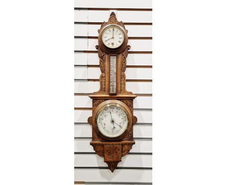 Early 20th century oak-cased aneroid barometer/thermometer&nbsp;with carved foliate motifs throughout the case, with a fitted