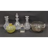Three cut glass decanters and stoppers, a yellow tinted globular vase, a 19th century gilt glass