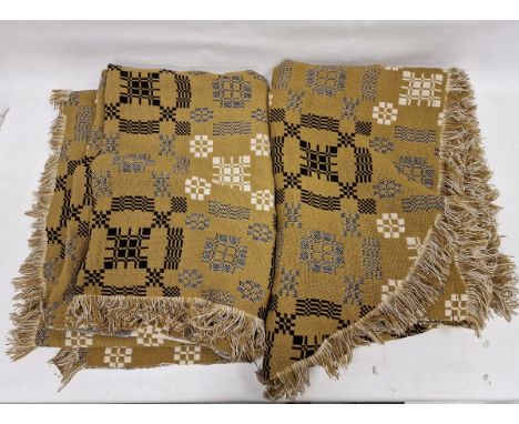 Pair of vintage Welsh wool tapestry blanket bedspreads, with rounded ends, mustard ground with chequered design in black and 