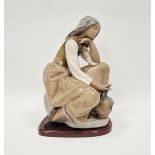 Lladro figure of a classic water carrier on wooden base, printed blue factory marks, circa 1982,
