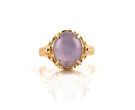 A star sapphire ring, comprises an oval star sapphire cabochon in pale purple colour, approximately measuring 10.7 x 8.6 mm, 