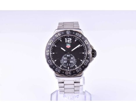 A Tag Heuer Professional Formula 1 stainless steel wristwatch the black dial with baton hour markers, and date aperture with 