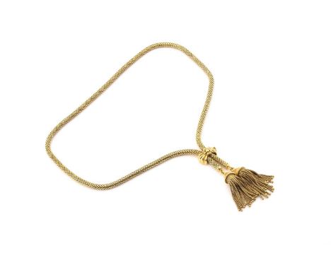 A lariat necklace in yellow precious metal, comprises a tubular mesh chain with tassel terminations, with a bow motif fold-ov