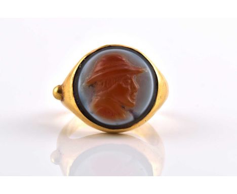 A Near Eastern ring with sardonyx cameo, depicting the portrait of Bactrian King Eucratides I, in a hollow high carat gold mo