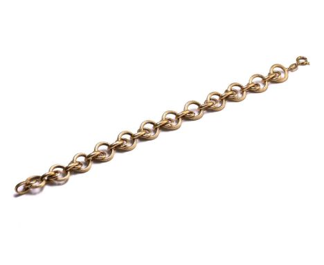 A fancy link bracelet in yellow precious metal, consists of hollow textured adjoining links, fastened with a spring-ring clas