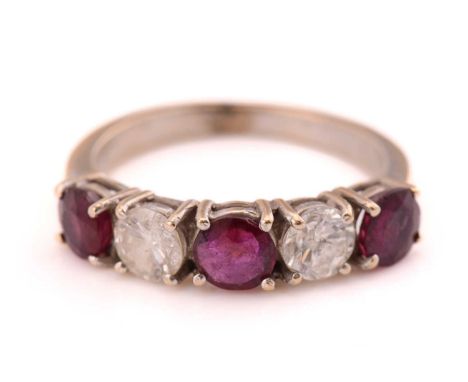 A ruby and diamond five-stones ring, consisting of two round brilliant diamonds with an estimated weight of 0.88ct, alternati