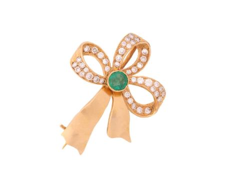 A gem-set bow brooch in yellow metal, consisting of a round emerald in the centre of the bow motif mount, embellished with di