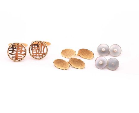 A pair of yellow metal cufflinks, the textured oval plaques with cross-hatched engraving, marked to the links '750'; together