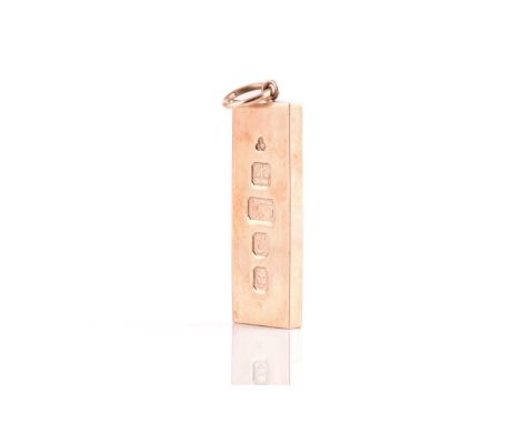 A 9ct gold ingot pendant, displaying feature marks, London hallmarked '375' with sponsor's mark 'KMJ', dated 1977, overall me