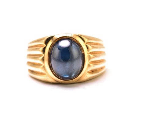 A sapphire gypsy ring, featuring a high dome sapphire cabochon with dark blue body colour, approximately measuring 10.0 x 8.0