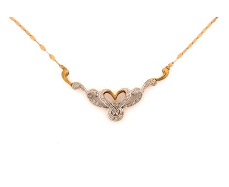 A diamond necklace in tri-coloured precious metal, comprises a diamond-set scrollwork mount, attached to a fancy link trace c