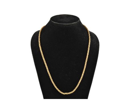 A lariat necklace in yellow precious metal, comprises a woven chain with textured spherical terminations, with a tilde shaped