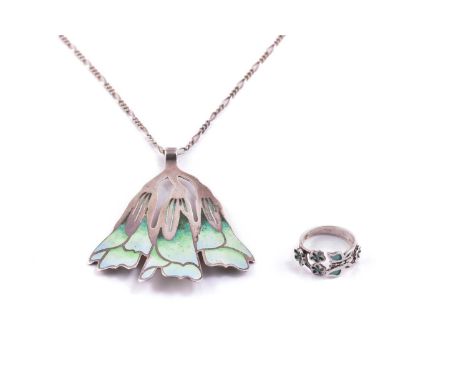 Norman Grant; An enamel pendant and an open band ring; The pendant has a flower spray motif enamelled with a light blue and v