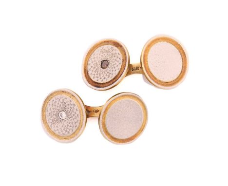 A pair of American bi-coloured cufflinks, each white metal, engine-turned circular plaque set with a single rose cut diamond;