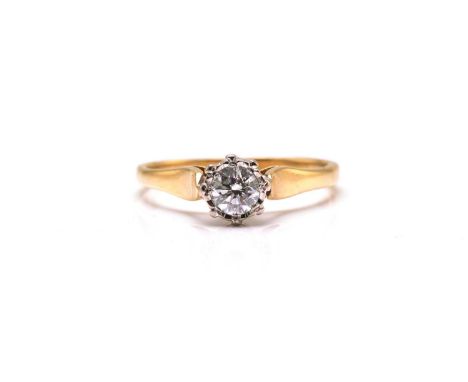 An 18ct gold solitaire diamond ring, comprises a brilliant diamond with an estimated weight of 0.271ct, illusion set on a hig