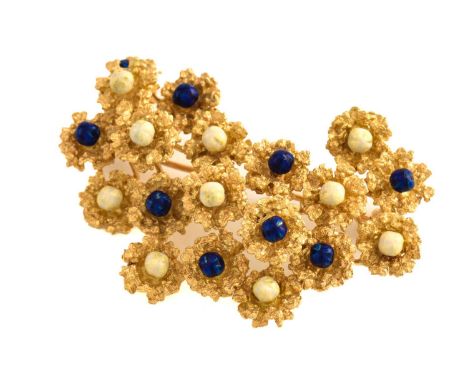 An enamelled abstract brooch, comprises an organically formed cast mount in yellow precious metal, with blue and white enamel