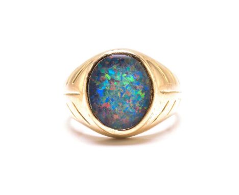 An opal triplet ring, comprises an oval precious opal triplet with dark body colour, with abundant play-of-colour effect in m