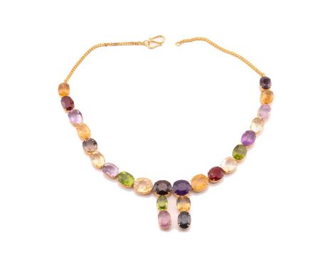 A multi gem-set rivière necklace in gilt metal, comprises a variety of oval mixed-cut gemstones such as amethysts, citrines, 
