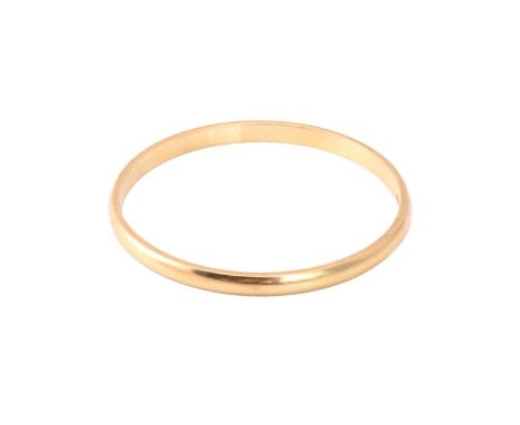 A yellow precious metal closed bangle, with a solid D-profile band, marked as '18ct OBLO', inner circumference approximately 