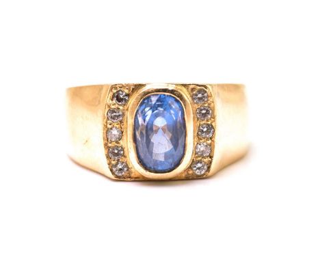 A sapphire and diamond ring, comprises a cushion-cut sapphire with purplish-blue body colour, measuring 8.0 x 5.2 mm in size,