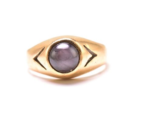 A star sapphire gypsy ring, featuring a round sapphire cabochon with greyish purplish-blue body colour, that shows asterism e