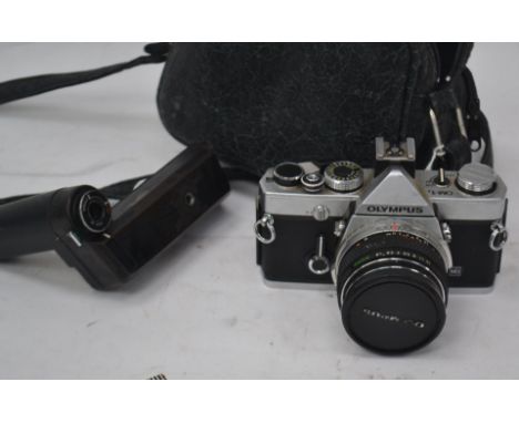 An Olympus OM-1 slr camera serial no 1739728 with an attached Olympus F.Zuiko 50 mm lens. Complete with an Olympus OM Winder 