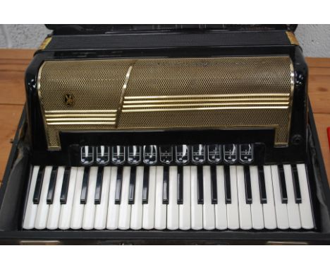 A vintage Hohner Accordion musical instrument, within the original case.

UK, European & Worldwide packaging available on all