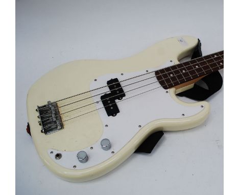 A 20th century Squire bass guitar with Olympic white body, notation to head