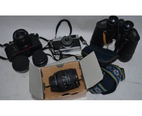 A collection of cameras and lenses to include a boxed Sigma 28-70mm f2.8-4 UC lens, Olympus Trip 35 camera, Pentax 50mm lens,