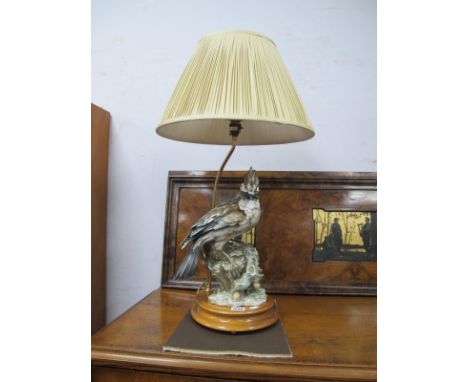 A Capodimonte Table Lamp, as an exotic bird on pear shaped base.