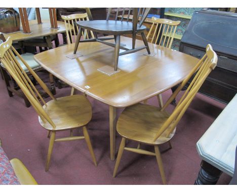 Ercol Ash Dining Table, with drop leaves, together with four Ercol dining chairs.Lot 1569 - Table - several deep scratches to