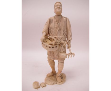 A Japanese Late XIX Century Sectional Ivory Figure of a Gentleman, holding a fork and a basket containing turtles, 28cm high.