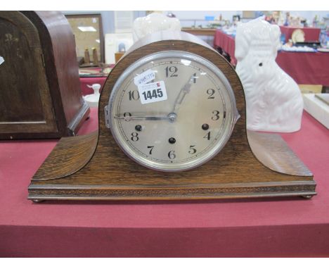 An Oak Dome Cased Mantle clock with Westminster chimes movement.